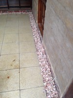 Termite treatment with pebble border